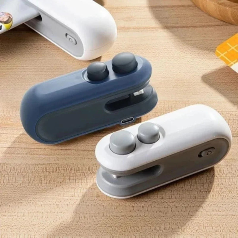 Mini Selador de Embalagem Recarregável USB com Cortador – Conservação de Alimentos e Vedação a Vácuo Portátil – CompraSmart™